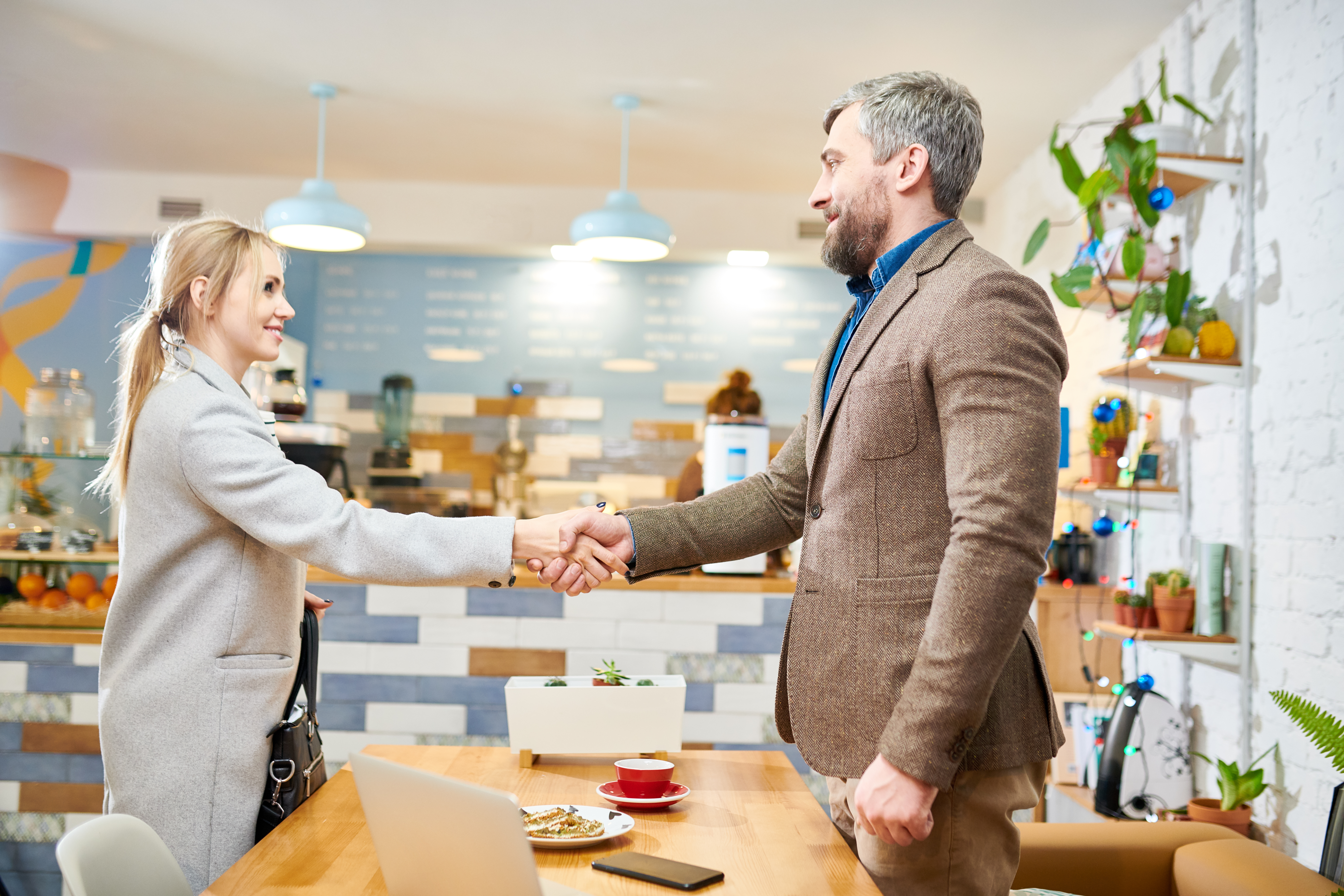 Business partners shaking hands after a successful meeting